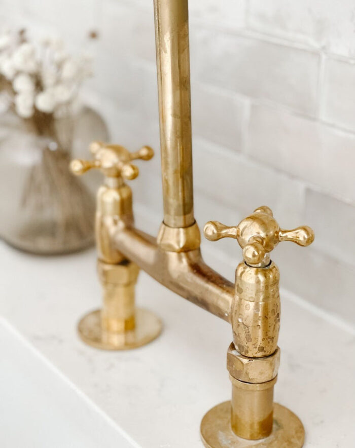 Unlacquered brass bridge kitchen faucet