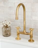 Unlacquered brass bridge kitchen faucet