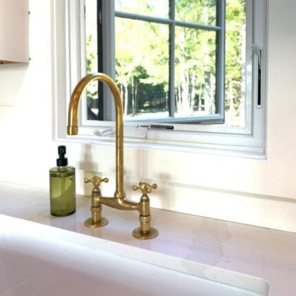 Unlacquered brass bridge kitchen faucet