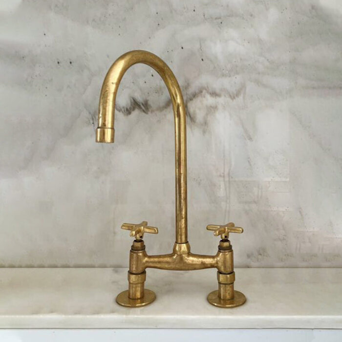 Unlacquered brass bridge kitchen faucet